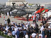 People attend the Dubai Airshow on November 18, 2019. KARIM SAHIB / AFP
