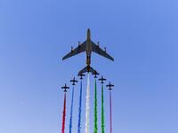 UAE elite aerobatic flying team "Al Fursan" escorts an Etihad A380 aircraft as they fly over the Yas Marina Circuit in Abu Dhabi, ahead of the final race of the Formula One Grand Prix season, on December 1, 2019. ANDREJ ISAKOVIC / AFP