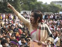 A woman shouts as she takes part in a musical concert along with others to protest against the Indian government's Citizenship Amendment Bill (CAB) in Guwahati on December 15, 2019. Sajjad HUSSAIN / AFP