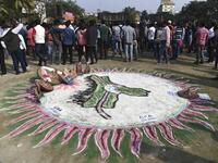 A traditional painting is pictured at a musical concert to protest against the Indian government's Citizenship Amendment Bill (CAB) in Guwahati on December 15, 2019. Some 5,000 people took part in a fresh demonstration in Guwahati on December 15, with hundreds of police watching on as they sang, chanted and carried banners with the words "long live Assam". SAJJAD HUSSAIN / AFP