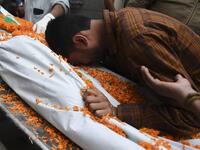 A relative mourns next to the dead body of Ishwor Nayak, 25, who was killed after police fired during a protest against the government's Citizenship Amendment Bill (CAB) three days before, in Guwahati on December 15, 2019. The death toll from violent protests in northeast India against a contentious citizenship law has risen to six, officials said on December 15, as authorities maintained internet bans and curfews to quell unrest. SAJJAD HUSSAIN / AFP