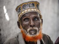 74-year-old Omar Dule, who lost his house due to the floods and heavy rains, gathers with some friends inside a United Nations tent at a displacement camp in Beledweyne, Somalia, on December 14, 2019. The rains have inundated big areas surrounding Beledweyne area forcing thousands of people to leave their houses and look for humanitarian assistance while living in displacement camps. Due to climate change and human activities, cycles of floods and droughts have become more recurrent and completely unpredict