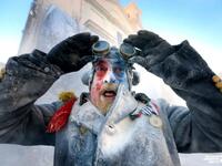 A resident takes part in a flour and egg battle during the 'Els enfarinats' festival in the village of Ibi, Alicante, eastern Spain (Twitter)