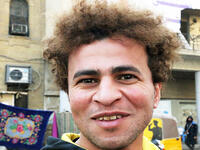 An Iraqi anti-government protestor poses with a distinct hairstyle at Tahrir Square in central Baghdad on December 23, 2019. Since the start of Iraq's anti-government protests on October 1, one thing strikes the eye perhaps above all else -- the unbridled hairstyles young men sport. High quiffs, tight fades and loads of attitude -- it is quite the male beauty pageant. SABAH ARAR / AFP