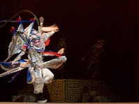 Chinese opera actor performs traditional drama onstage (Shutterstock)