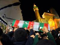 Mourners carry the coffin of slain Iranian military commander Qasem Soleimani, toward the Imam Ali Shrine, in the shrine city of Najaf in central Iraq during a funeral procession on January 4, 2020. Thousands of Iraqis chanted "Death to America" today as they mourned the deaths of al-Muhandis and Soleimani, who were killed in a US drone attack that sparked fears of a regional proxy war between Washington and Tehran. Haidar HAMDANI / AFP