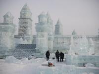 China's annual ice festival in Harbin has kicked off late on January 5 with couples lining up for a snow-themed mass wedding, swimmers braving frigid waters and frozen palaces rising from the ground. NOEL CELIS / AFP
