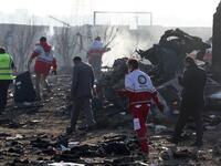 Rescue teams work amidst debris after a Ukrainian plane carrying 176 passengers crashed near Imam Khomeini airport in the Iranian capital Tehran early in the morning on January 8, 2020, killing everyone on board. The Boeing 737 had left Tehran's international airport bound for Kiev, semi-official news agency ISNA said, adding that 10 ambulances were sent to the crash site. AFP