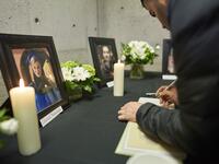 Mourners sign books of condolence at a memorial service at Western University in London, Ontario on January 8, 2020, for 4 of the school’s graduate students who were killed in the plane crash in Iran, including Ghazal Nourian. A Ukrainian airliner crashed shortly after take-off from Tehran on January 8 killing all 176 people on board, in a disaster striking a region rattled by heightened military tensions. Geoff Robins / AFP