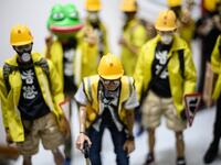 This picture taken on January 14, 2020 shows 1:6 scale action figures depicting characters involved in the Hong Kong protests, in Hong Kong. Intricately detailed Hong Kong protester figurines have become the latest must-have collectables as toy stores recreate the pro-democracy movement's street battles with police in their shop displays.  Philip FONG / AFP
