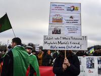 People stage a protest against Algerian president Abdelmadjid Tebboune during the Peace summit on Libya at the Chancellery in Berlin on January 19, 2020. AFP