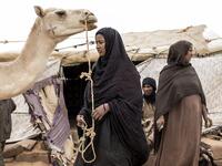A family from the small Nemadi(hunters) tribe in Eastern Mauritania is seen at outside their families tent in the Loudeyatt Nemadi Camp on January 23, 2020. In the arid West African country of Mauritania, the way of life of the traditional group of hunters known as the Nemadi is slowly disappearing. JOHN WESSELS / AFP