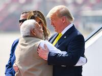 India's Prime Minister Narendra Modi (L) embraces US President Donald Trump upon his arrival at Sardar Vallabhbhai Patel International Airport in Ahmedabad on February 24, 2020. MANDEL NGAN / AFP