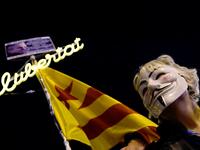 A demonstrator sporting a Guy Fawkes mask takes part in a protest called by Catalan National Assembly (ANC) under the motto "Journalism is not a crime" to support WikiLeaks founder Julian Assange in Barcelona on February 24, 2020. A British court today started hearing Washington's extradition request for WikiLeaks founder Julian Assange in a test case of media freedoms in the digital age and the global limits of US justice. LLUIS GENE / AFP