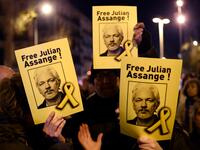 Demonstrators hold signs during a protest called by Catalan National Assembly (ANC) under the motto "Journalism is not a crime" to support WikiLeaks founder Julian Assange in Barcelona on February 24, 2020. A British court today starts hearing Washington's extradition request for WikiLeaks founder Julian Assange in a test case of media freedoms in the digital age and the global limits of US justice. LLUIS GENE / AFP