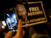 A demonstrator takes a picture with a smartphone during a protest called by Catalan National Assembly (ANC) under the motto "Journalism is not a crime" to support WikiLeaks founder Julian Assange in Barcelona on February 24, 2020. A British court today starts hearing Washington's extradition request for WikiLeaks founder Julian Assange in a test case of media freedoms in the digital age and the global limits of US justice. LLUIS GENE / AFP