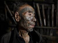 This photo taken on February 9, 2020 shows Nok Tan, 75, a tattooed Konyak tribeman, in his house in a village in Sagaing region of Myanmar, wedged in a semi-autonomous zone near the Indian border. People in the region subscribe to a complex patchwork of customs, intertwining their animist beliefs with warrior traditions that include striking tattoo designs, which can signify tribal identity, life accomplishments or the completion of a rite of passage. Ye Aung THU / AFP