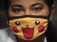 A doctor wears a face mask as a precautionary measure against the spread of the new coronavirus, COVID-19, as she waits for patients at a market in Managua, on March 18, 2020. The Nicaraguan government, which has not officially reported Covid-19 cases, continues to accept the arrival of tourists and massive activities, an attitude considered "irresponsible" by the opposition and health professionals. Inti OCON / AFP