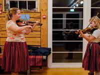 Maria Michelson, music teacher, gives a violon lesson on November 20, 2019 on Kihnu island in the Baltic Sea, 10 kilometres (six miles) off the coast of Estonia. Steeped in folk traditions, Kihnu's historic way of life however is now threatened as economic hardship drives more and more islanders away in search of work. Alessandro RAMPAZZO / AFP