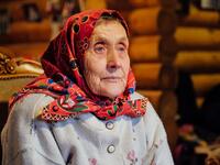 Nationally renowned folk singer Virve Köster answers journalists' questions on November 20, 2019 on Kihnu island in the Baltic Sea, 10 kilometres (six miles) off the coast of Estonia. Steeped in folk traditions, Kihnu's historic way of life however is now threatened as economic hardship drives more and more islanders away in search of work. Alessandro RAMPAZZO / AFP