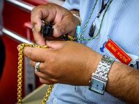 An employee checks a gold chain offered for sale in a gold shop in Bangkok's Chinatown on April 15, 2020. Hundreds of Bangkok residents rushed to goldsmith shops in order to sell their jewelries as gold prices reached its highest levels since 2012. Mladen ANTONOV / AFP