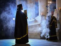 Romanian Christian Orthodox priests hold a religious service on the Good Friday, two days before Orthodox Easter celebration at the Patriarchal Cathedral in Bucharest April 17, 2020. Due to the emergency state called by the romanian authorities to slow down the coronavirus infection all the religious services will be held without believers inside or around the churches. Daniel MIHAILESCU / AFP
