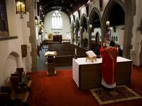 Father Peter Turrone leads a Palm Sunday mass to an empty church at the St. Thomas Aquinas Catholic Church on April 5, 2020 in Toronto, Canada. Cole Burston / GETTY IMAGES NORTH AMERICA / Getty Images via AFP