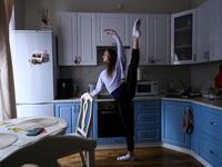 Bolshoi ballet dancers Margarita Shrainer and Igor Tsvirko have placed a linoleum mat and a barre. Since the start of the lockdown, the couple, both soloists in the legendary troupe, have largely used their own initiative to keep up their dance skills at home. Kirill KUDRYAVTSEV / AFP