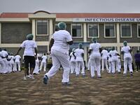 Nurses assigned to the Infectious Diseases Unit (IDU) at the Kenyatta University Hospital dance during a Zumba class held at the hospital compound in Nairobi, on May 17, 2020. Coinciding with the morning shift rotation the class, aimed to offer some respite to nurses charged with the management of patients infected with COVID-19 coronavirus, was organised by the Nursing Council of Kenya (NCK) and the Kenyatta Univesity Teaching, Refferal and Research Hospital in the Kenyan capital. TONY KARUMBA / AFP