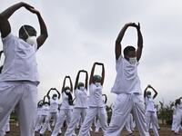 Nurses assigned to the Infectious Diseases Unit (IDU) at the Kenyatta University Hospital dance during a Zumba class held at the hospital compound in Nairobi, on May 17, 2020. Coinciding with the morning shift rotation the class, aimed to offer some respite to nurses charged with the management of patients infected with COVID-19 coronavirus, was organised by the Nursing Council of Kenya (NCK) and the Kenyatta Univesity Teaching, Refferal and Research Hospital in the Kenyan capital. TONY KARUMBA / AFP