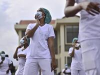 Nurses assigned to the Infectious Diseases Unit (IDU) at the Kenyatta University Hospital dance during a Zumba class held at the hospital compound in Nairobi, on May 17, 2020. Coinciding with the morning shift rotation the class, aimed to offer some respite to nurses charged with the management of patients infected with COVID-19 coronavirus, was organised by the Nursing Council of Kenya (NCK) and the Kenyatta Univesity Teaching, Refferal and Research Hospital in the Kenyan capital. TONY KARUMBA / AFP