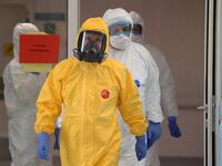President Vladimir Putin donned a yellow protective suit to visit the top Moscow hospital treating coronavirus patients (Twitter)