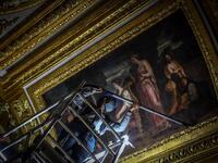 An employee wearing a protective face mask cleans the Queen's grand appartment at the Chateau de Versailles (Palace of Versailles) in Versailles near Paris, on June 5, 2020 on the eve of it re-opening after 82 days of closure due to the novel coronavirus (COVID-19) outbreak. The Palace of Versailles -- France's big tourist attraction with nearly 10 million tourists a year - will open on June 6 with no US or Asia tourists who represent 30% of its visitors. STEPHANE DE SAKUTIN / AFP