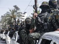 Members of the Palestinian Islamic Jihad militant take part in a symbolic funeral for the movement's former leader Ramadan Shalah in Gaza city, on June 7, 2020, a day after he died in neighbouring Lebanon. The 62-year-old died in a Beirut hospital after a long illness, before his body was transported to neighbouring Syria, a Palestinian source said. MAHMUD HAMS / AFP