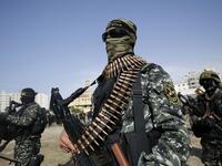 Members of the Palestinian Islamic Jihad group take part in a military parade during a condolence ceremony for the movement's former leader Ramadan Shalah in Gaza city, on June 8, 2020, two days after his death in neighbouring Lebanon. The 62-year-old was buried in Syria on June 7, a day following his death after a long illness. Mohammed ABED / AFP