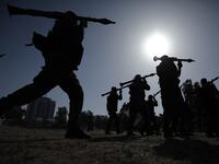 Members of the Palestinian Islamic Jihad group take part in a military parade during a condolences ceremony for the movement's former leader Ramadan Shalah in Gaza city, on June 8, 2020, two days after his death in neighbouring Lebanon. The 62-year-old was buried in Syria on June 7, a day following his death after a long illness. Mohammed ABED / AFP