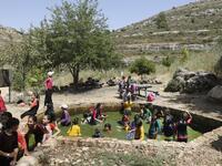 Israeli children from the nearby settlement of Shilo are pictured at a water spring on June 8, 2020 near the Palestinian village of Turmus‘ayya in the occupied West Bank. The government of Israeli Prime Minister Benjamin Netanyahu has said it could begin the process to annex Jewish settlements in the West Bank as well as the strategic Jordan Valley from July 1. The plan -- endorsed by Washington -- would see the creation of a Palestinian state, but on reduced territory, and without Palestinians' core demand