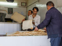 Traditional bread. In Farsi, bread is Naan. The names Naan-e Sangak or Naan-e Barbari, mean Sangak Bread or Barbari Bread (Shutterstock)	