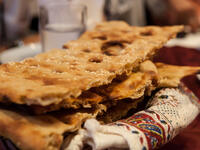 Sangak, a leavened Iranian flatbread. In Persian 'sangak' means little stone, as the bread is baked on small stones in a traditional oven (Shutterstock)	