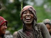 Splashing mud and drinking local rice beer, Nepali farmers this week celebrated National Paddy Day to mark the beginning of the rice-planting season, despite some coronavirus lockdown measures still in place. Traditional farming songs and laughter echoed in the air as farmers waded into waterlogged fields to sow green paddy.  PRAKASH MATHEMA / AFP
