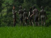 Splashing mud and drinking local rice beer, Nepali farmers this week celebrated National Paddy Day to mark the beginning of the rice-planting season, despite some coronavirus lockdown measures still in place. Traditional farming songs and laughter echoed in the air as farmers waded into waterlogged fields to sow green paddy.  PRAKASH MATHEMA / AFP