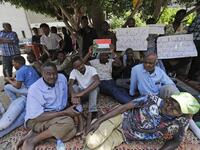Sudanese workers, who lost their jobs due to the deteriorating economic situation in Lebanon, protest outside their county's embassy in Beirut to demand repatriation, on July 2, 2020. JOSEPH EID / AFP