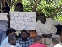 Sudanese workers, who lost their jobs due to the deteriorating economic situation in Lebanon, protest outside their county's embassy in Beirut to demand repatriation, on July 2, 2020. JOSEPH EID / AFP
