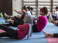 Youths from the "Children without Shelter" program attend a fitness sessions in their residences at Banati foundation in 6th October City on the outskirts of the capital Cairo on July 13, 2020. Khaled DESOUKI / AFP