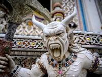 This photograph taken on July 14, 2020 shows a statue of an imaginary creature outside the Wat Pariwat Buddhist temple in Bangkok. Wat Pariwat, also known as "the David Beckham Temple", is decorated with statues of superheroes and comic characters as well as mythical and imaginary creatures. A golden-plated sculpture of the English football player holding the base of a Buddha statue in one of the buildings gives the temple its nickname.