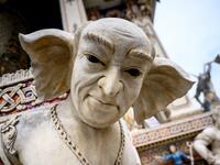 This photograph taken on July 14, 2020 shows the statue of an imaginary creature outside the Wat Pariwat Buddhist temple in Bangkok. Wat Pariwat, also known as "the David Beckham Temple", is decorated with statues of superheroes and comic characters as well as mythical and imaginary creatures. A golden-plated sculpture of the English football player holding the base of a Buddha statue in one of the buildings gives the temple its nickname.