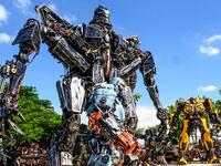 This photograph taken on July 18, 2020 shows life-sized sculptures of characters from the "Transformers" film franchise made of scrap metal parts at the Ban Hun Lek museum in Ang Thong, some 100km north of Bangkok. "Ban Hun Lek" or "The House of Steel Robots" is a museum where a collective of artists display their scrap metal creations depicting popular comics and sci-fi film characters. Mladen ANTONOV / AFP