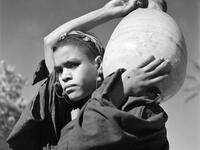 Portrait of a young woman who went to fetch water in a wadi, in the Tafilalet region, southern Morocco, in October 1945. AFP