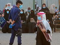 Muslims worshippers perform prayers at a stadium in Bayan district in Kuwait City on July 31, 2020 on the first day of Eid al-Adha. Eid al-Adha (the Festival of Sacrifice) is celebrated throughout the Muslim world as a commemoration of Abraham's willingness to sacrifice his son for God, and cows, camels, goats and sheep are traditionally slaughtered on the holiest day YASSER AL-ZAYYAT / AFP