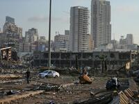 A picture shows the scene of an explosion at the port in the Lebanese capital Beirut on August 4, 2020. Two huge explosion rocked the Lebanese capital Beirut, wounding dozens of people, shaking buildings and sending huge plumes of smoke billowing into the sky. STR / AFP